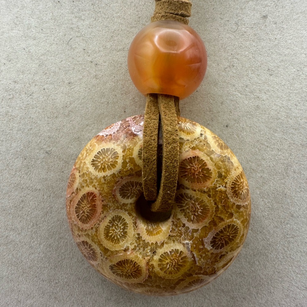 Brown and Tan Coral Fossil Donut Pendant Necklace on Brown Faux Suede - Picture 6 of 13